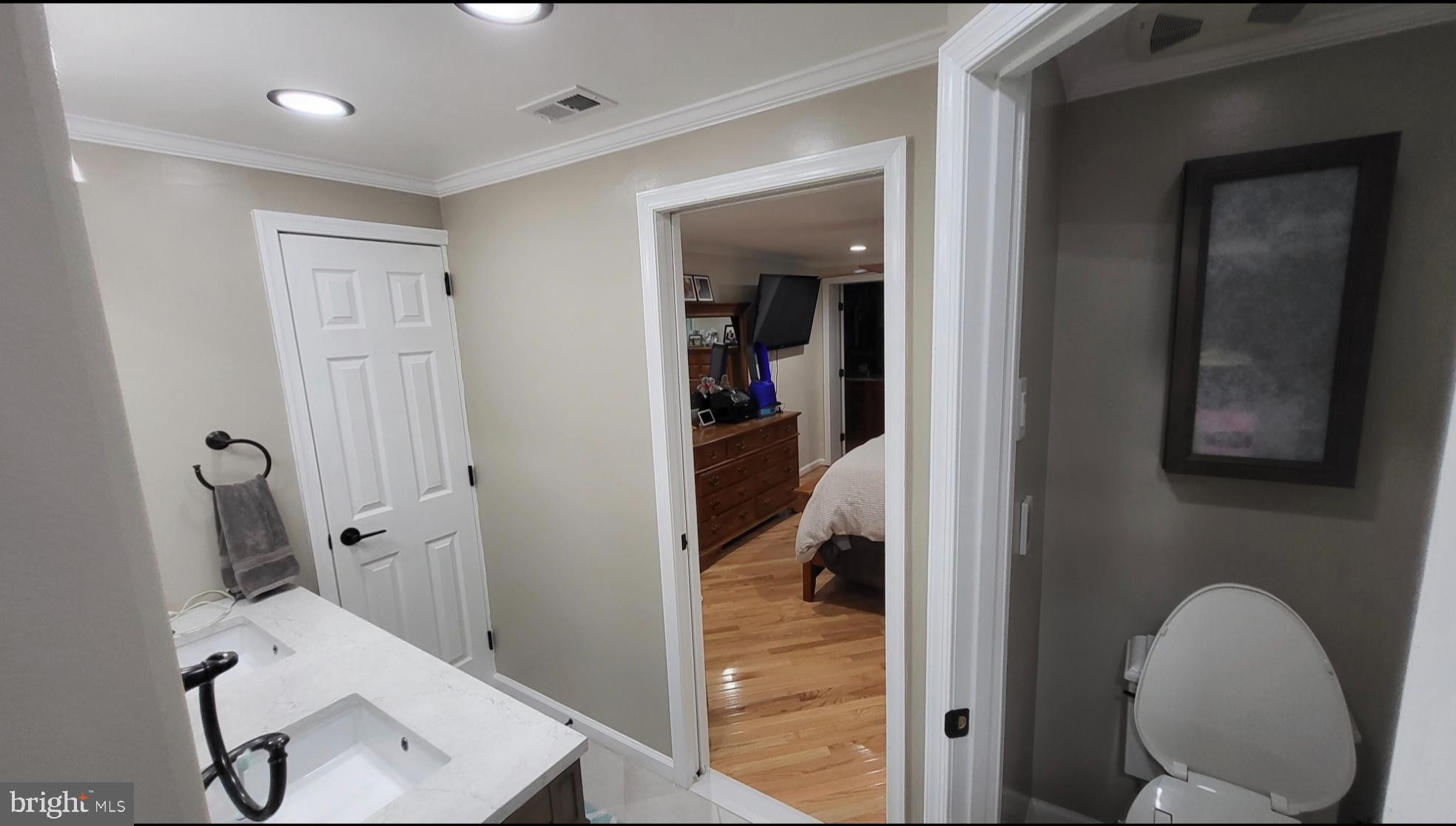 8001 Postoak Road Potomac, MD 20854 - Photo 18 of 30 a view of a hallway with workspace and a couch