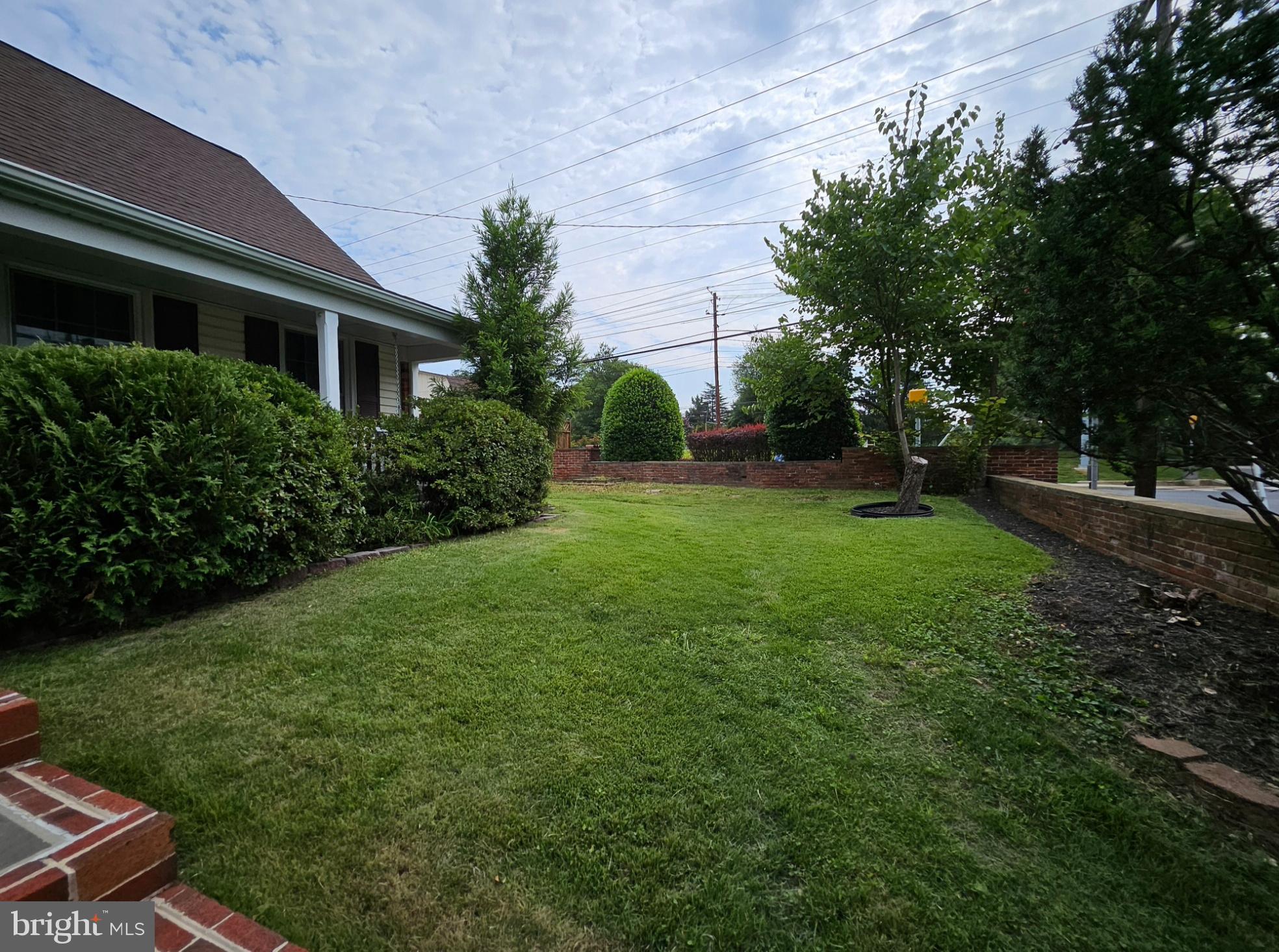 8001 Postoak Road Potomac, MD 20854 - Photo 2 of 30 a view of backyard with garden and trees