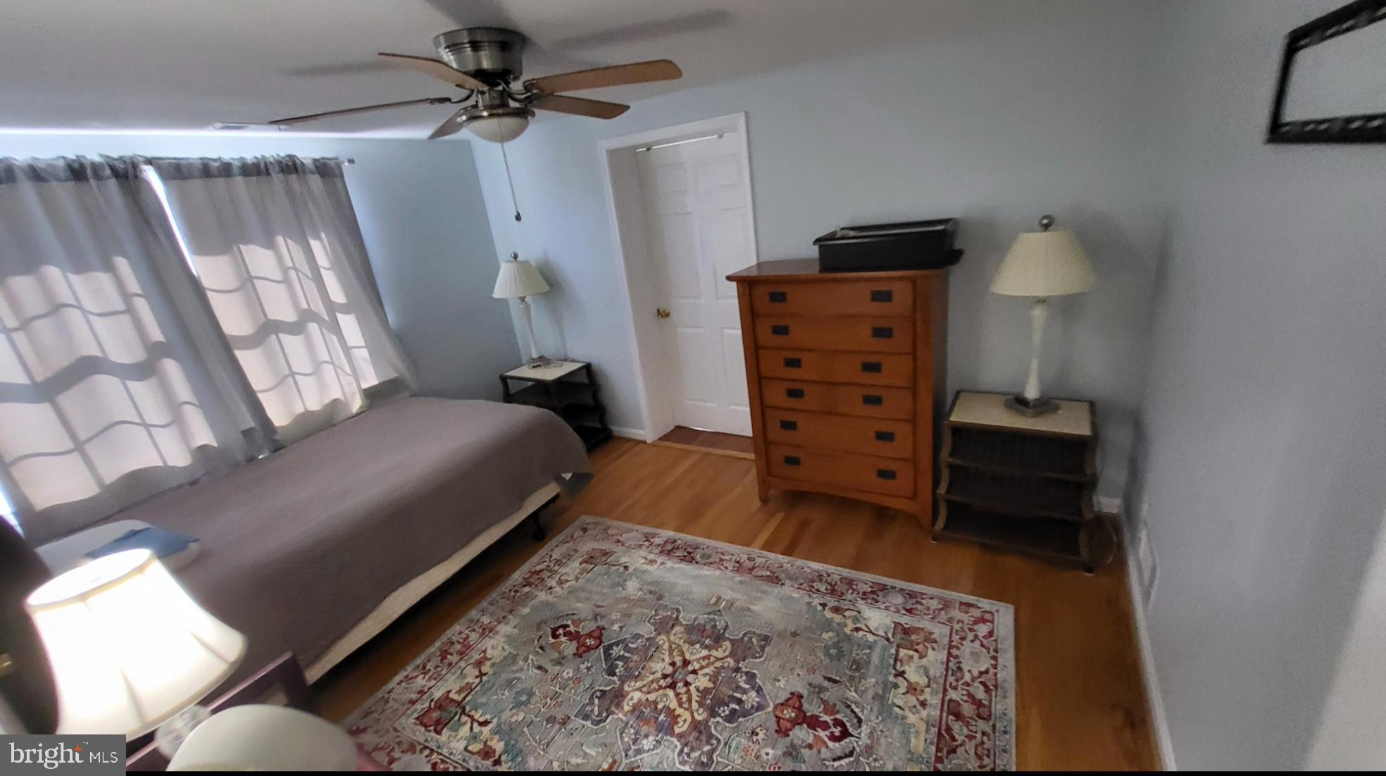 8001 Postoak Road Potomac, MD 20854 - Photo 21 of 30 a bedroom with a bed window and a table