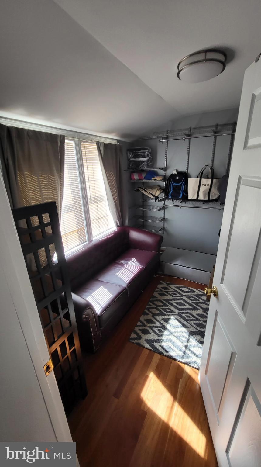 8001 Postoak Road Potomac, MD 20854 - Photo 22 of 30 a living room with chairs and a piano