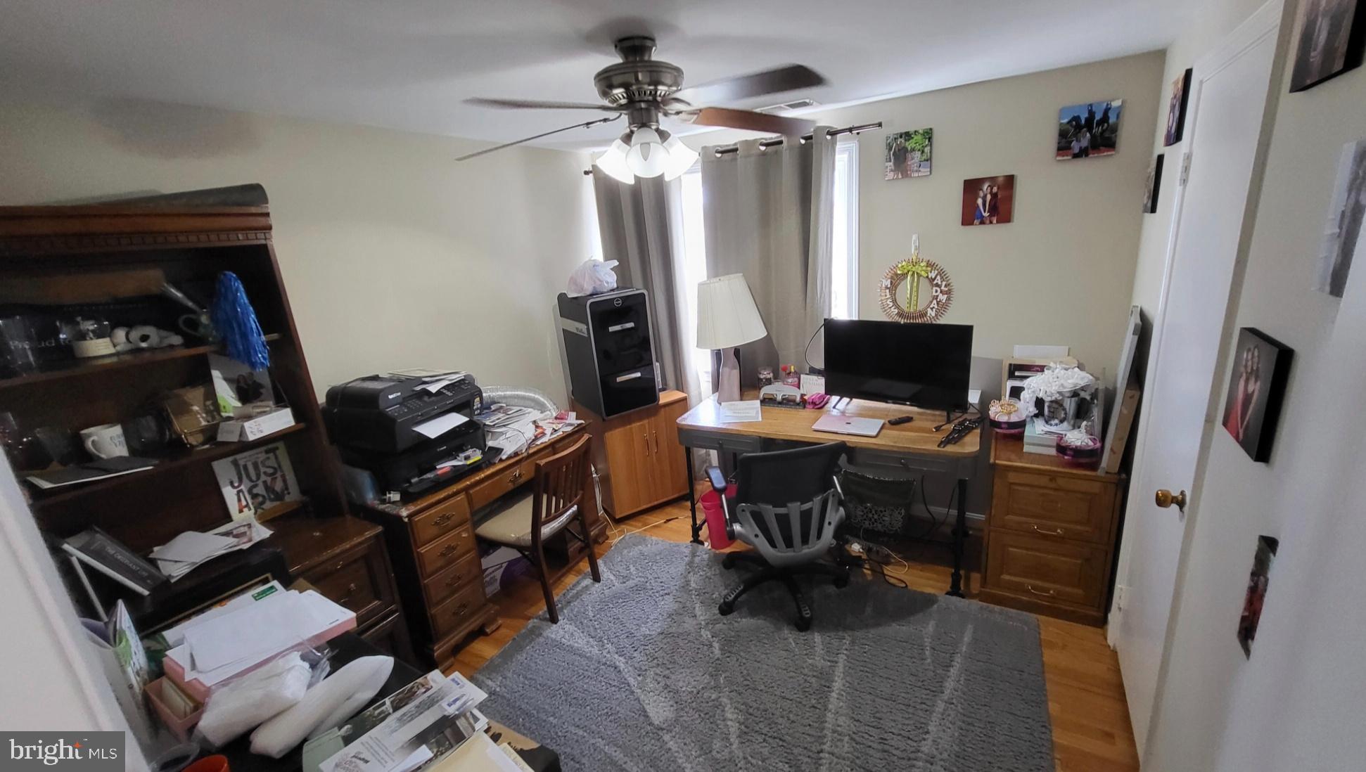 8001 Postoak Road Potomac, MD 20854 - Photo 24 of 30 a view of a workspace with furniture and a window