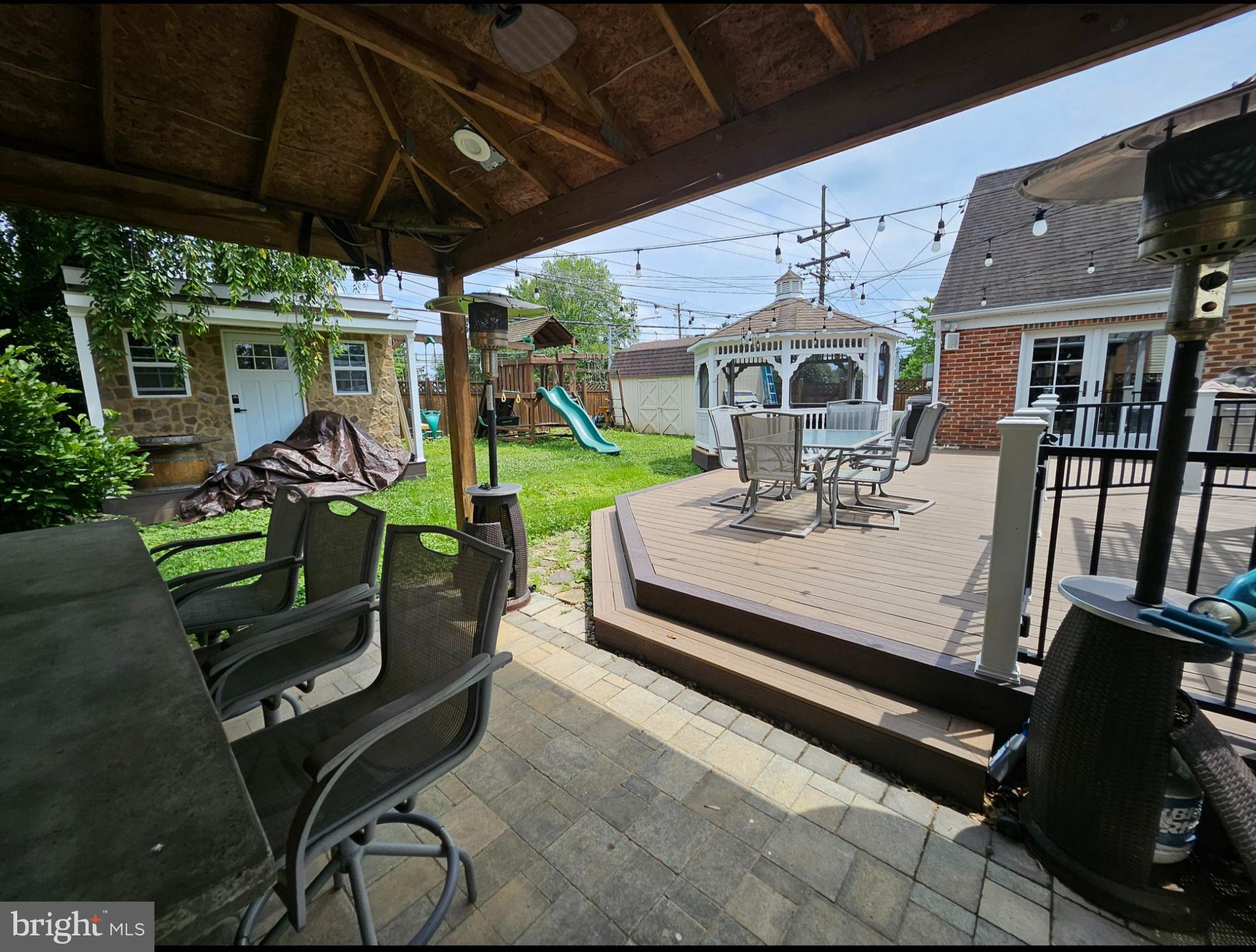 8001 Postoak Road Potomac, MD 20854 - Photo 29 of 30 a view of a patio with table and chairs potted plants with wooden floor