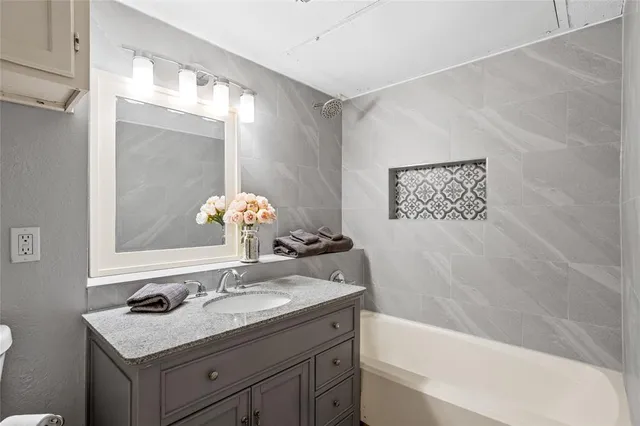 a bathroom with a sink and a bathtub