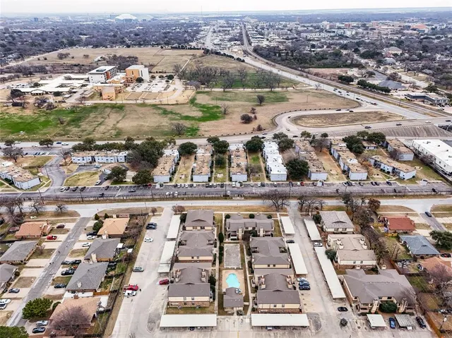 an aerial view of residential houses and lake view