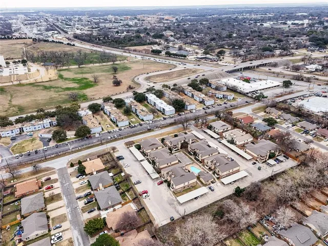 an aerial view of a city with lawn chairs