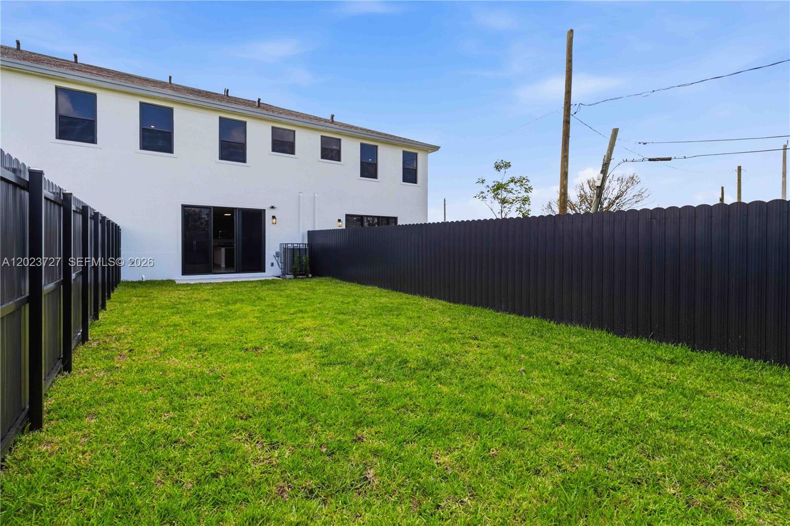 22348 Southwest 115th Court, Unit 22348 Miami, FL 33170 - Photo 36 of 37 a house view with a garden space