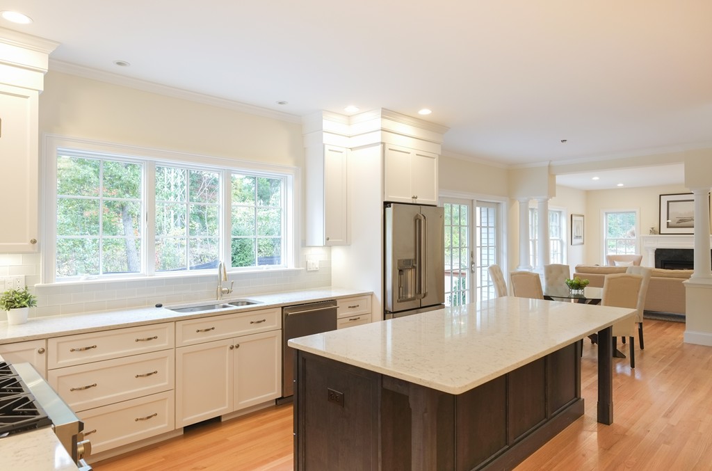 30 Michael Road Wayland, MA 01778 - Photo 8 of 24 a kitchen with stainless steel appliances granite countertop a kitchen island hardwood floor sink stove and refrigerator