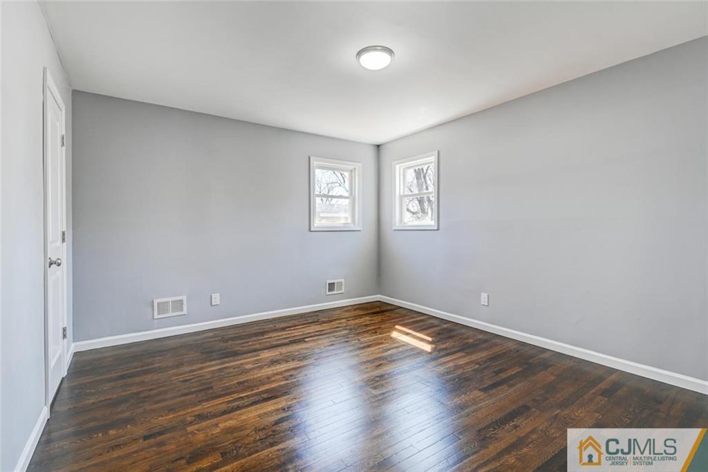 30 Purdue Road Old Bridge, NJ 08859 - Photo 12 of 25 a view of an empty room with wooden floor and a window