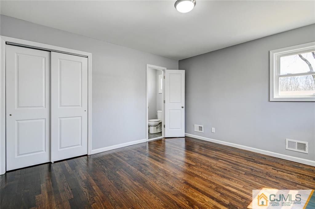 30 Purdue Road Old Bridge, NJ 08859 - Photo 13 of 25 a view of an empty room with wooden floor and a window