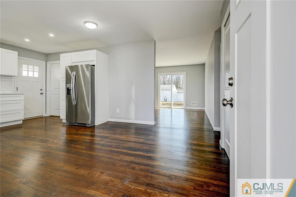 30 Purdue Road Old Bridge, NJ 08859 - Photo 3 of 25 a view of an empty room with wooden floor and a bathroom