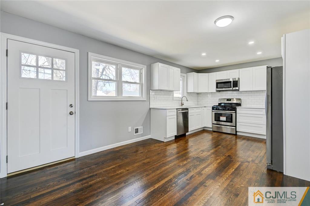 30 Purdue Road Old Bridge, NJ 08859 - Photo 4 of 25 a kitchen with stainless steel appliances granite countertop a refrigerator and a stove top oven