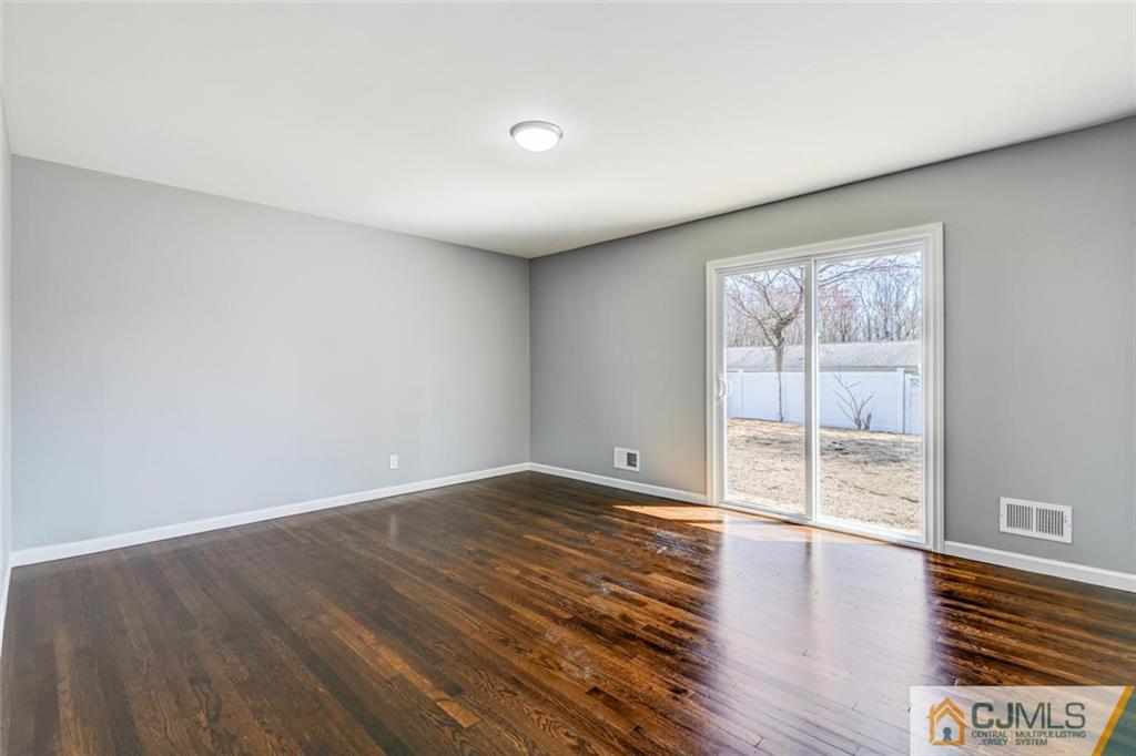 30 Purdue Road Old Bridge, NJ 08859 - Photo 8 of 25 wooden floor in an empty room with a window