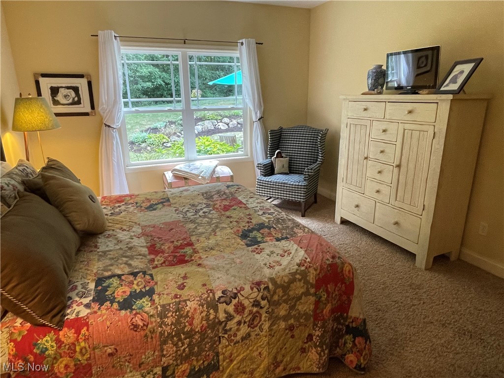8322 Forest Ridge Street Northwest Massillon, OH 44646 - Photo 25 of 33 Carpeted bedroom featuring baseboards