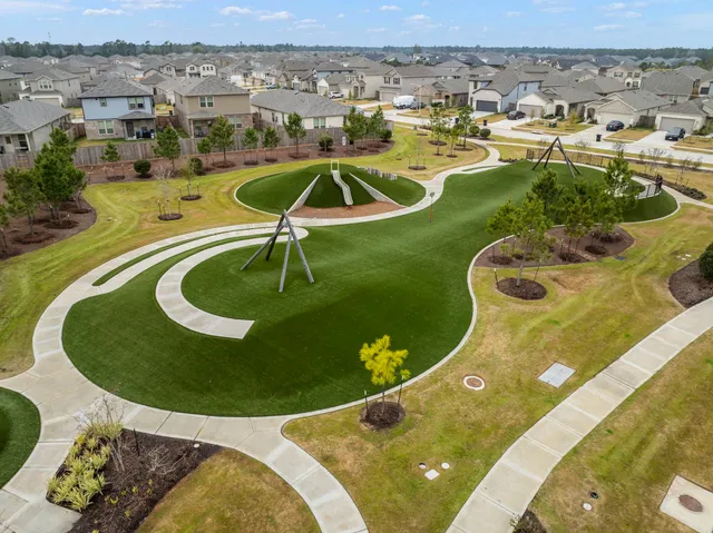 an aerial view of a house with a swimming pool