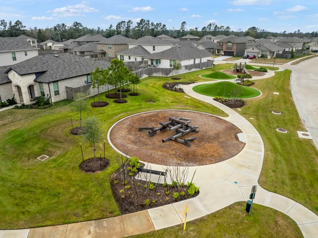 an aerial view of a house with outdoor space