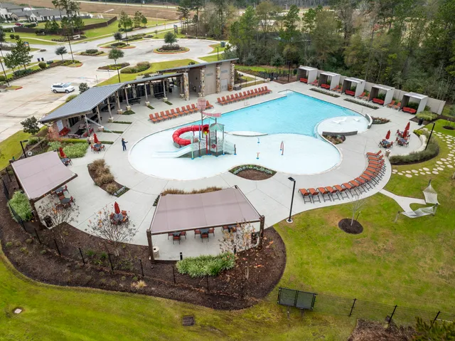 an aerial view of a house with outdoor space