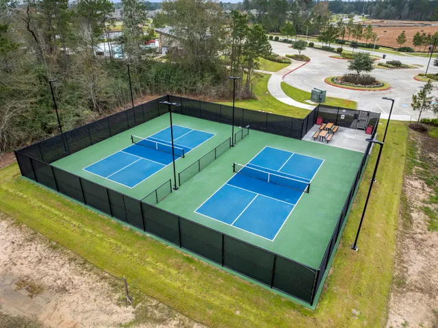 a view of a swimming pool with seating area