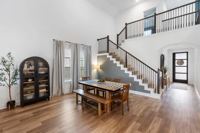 a view of a livingroom with furniture and hardwood floor