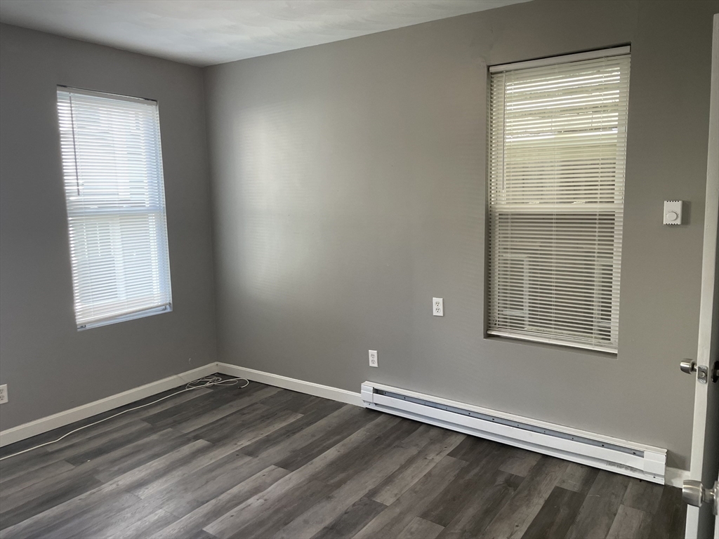 8 Cheever Court, Unit 1 Boston, MA 02128 - Photo 11 of 16 an empty room with a window