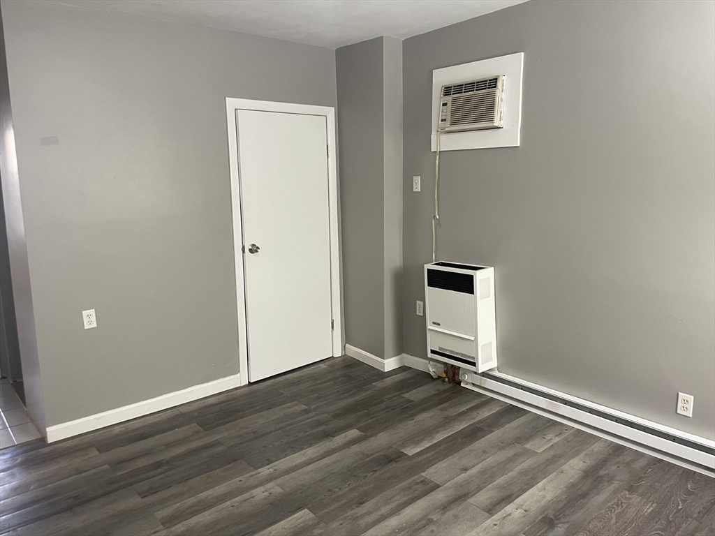 8 Cheever Court, Unit 1 Boston, MA 02128 - Photo 12 of 16 a view of a livingroom with wooden floor and a window