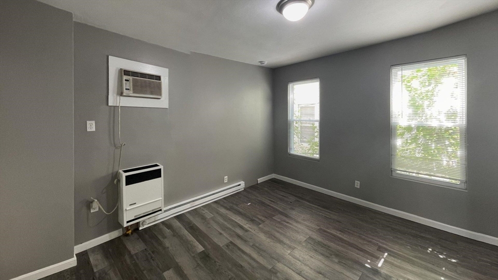 8 Cheever Court, Unit 1 Boston, MA 02128 - Photo 4 of 16 a view of an empty room with wooden floor and a window