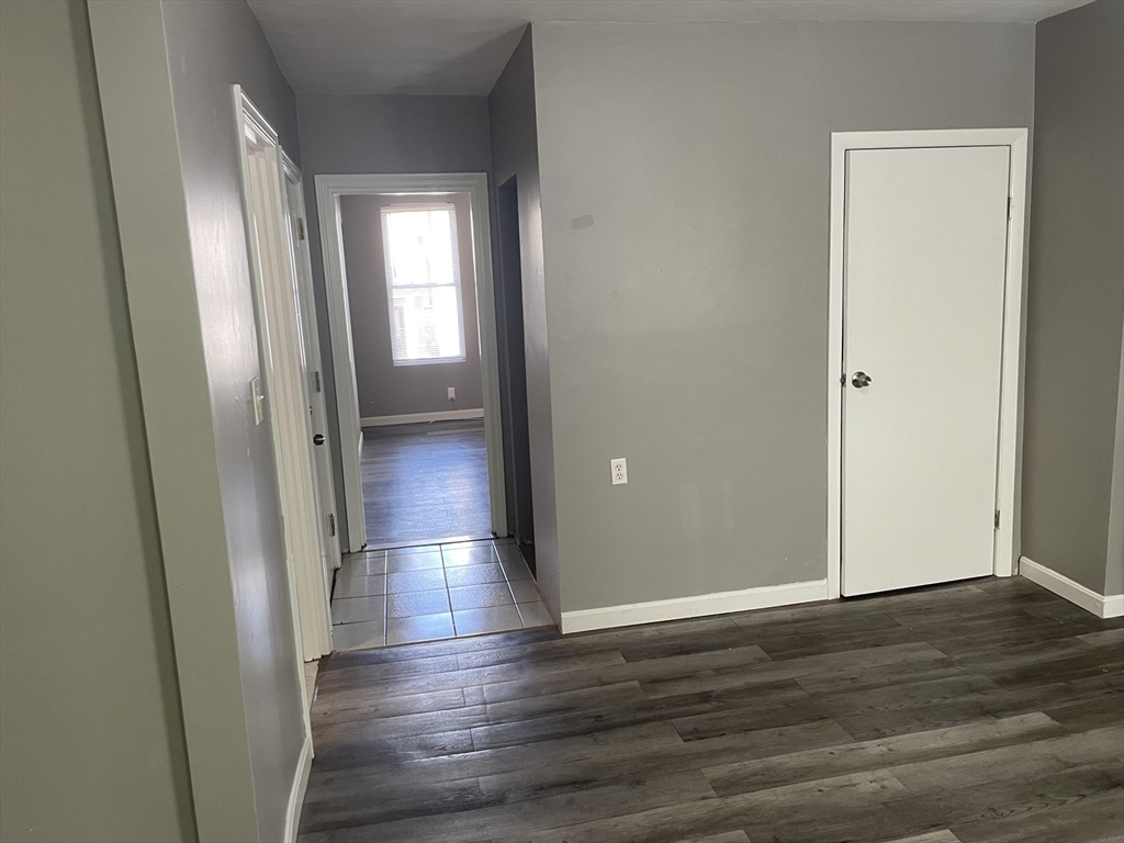 8 Cheever Court, Unit 1 Boston, MA 02128 - Photo 6 of 16 a view of hallway with wooden floor