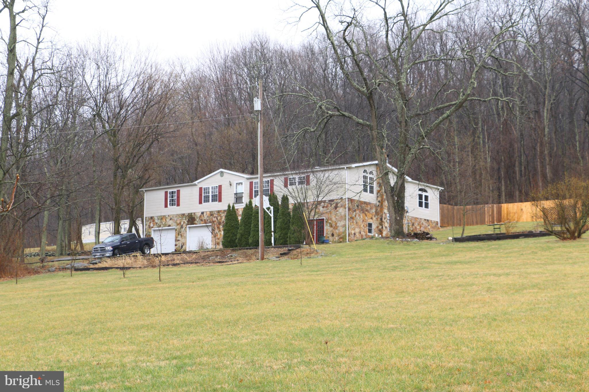 24709 Raven Rock Road Smithsburg, MD 21783 - Photo 1 of 20 a swimming pool with outdoor seating and yard