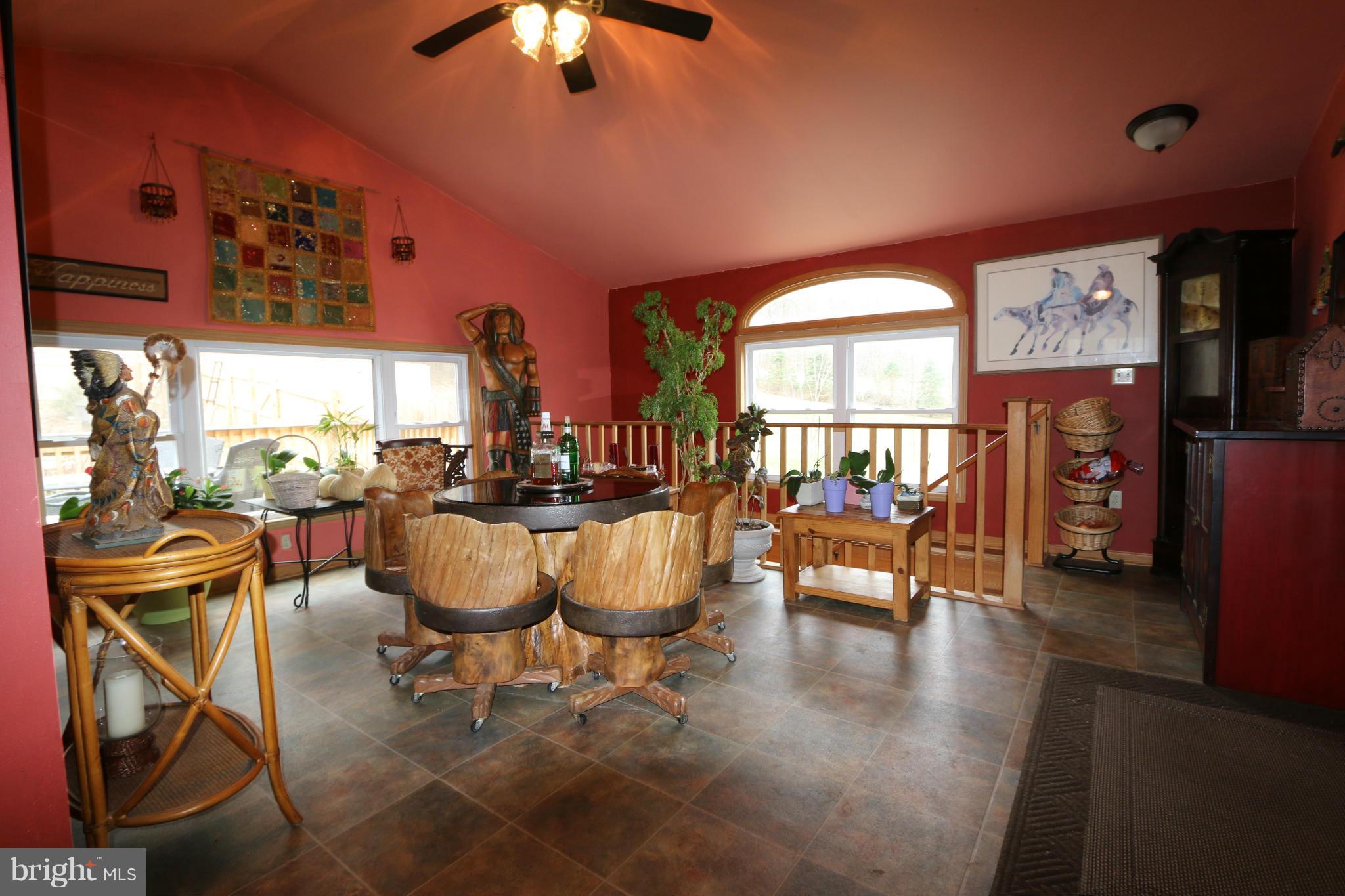 24709 Raven Rock Road Smithsburg, MD 21783 - Photo 14 of 20 a living room with fireplace furniture and a large window