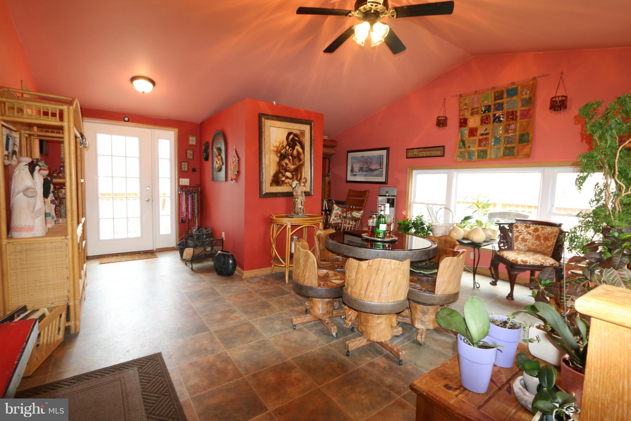 24709 Raven Rock Road Smithsburg, MD 21783 - Photo 15 of 20 a view of a dining room with furniture window and outside view