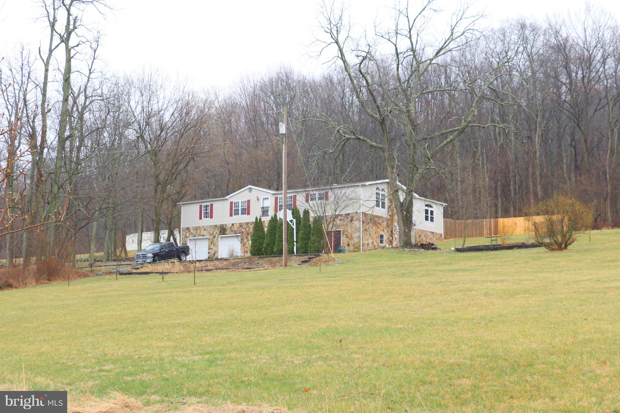 24709 Raven Rock Road Smithsburg, MD 21783 - Photo 20 of 20 a building with trees in front of it