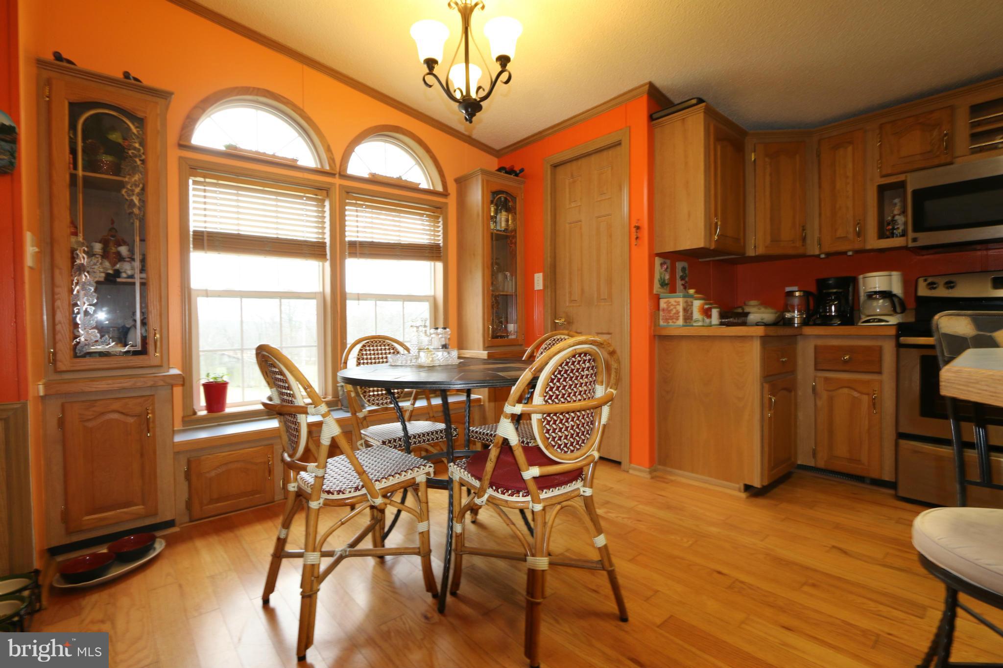 24709 Raven Rock Road Smithsburg, MD 21783 - Photo 5 of 20 a view of a dining room with furniture window and wooden floor
