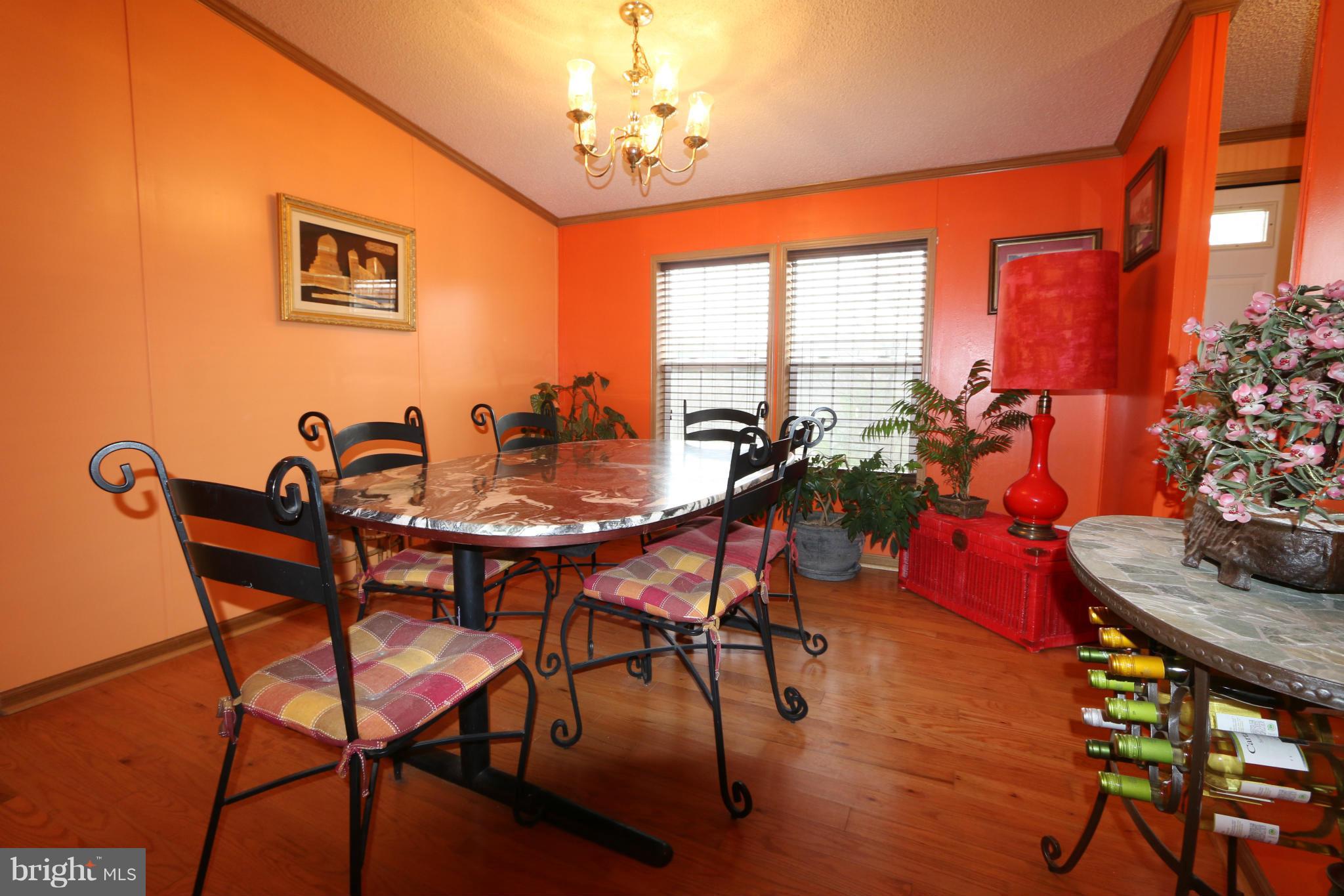 24709 Raven Rock Road Smithsburg, MD 21783 - Photo 7 of 20 a view of a dining room with furniture window and wooden floor