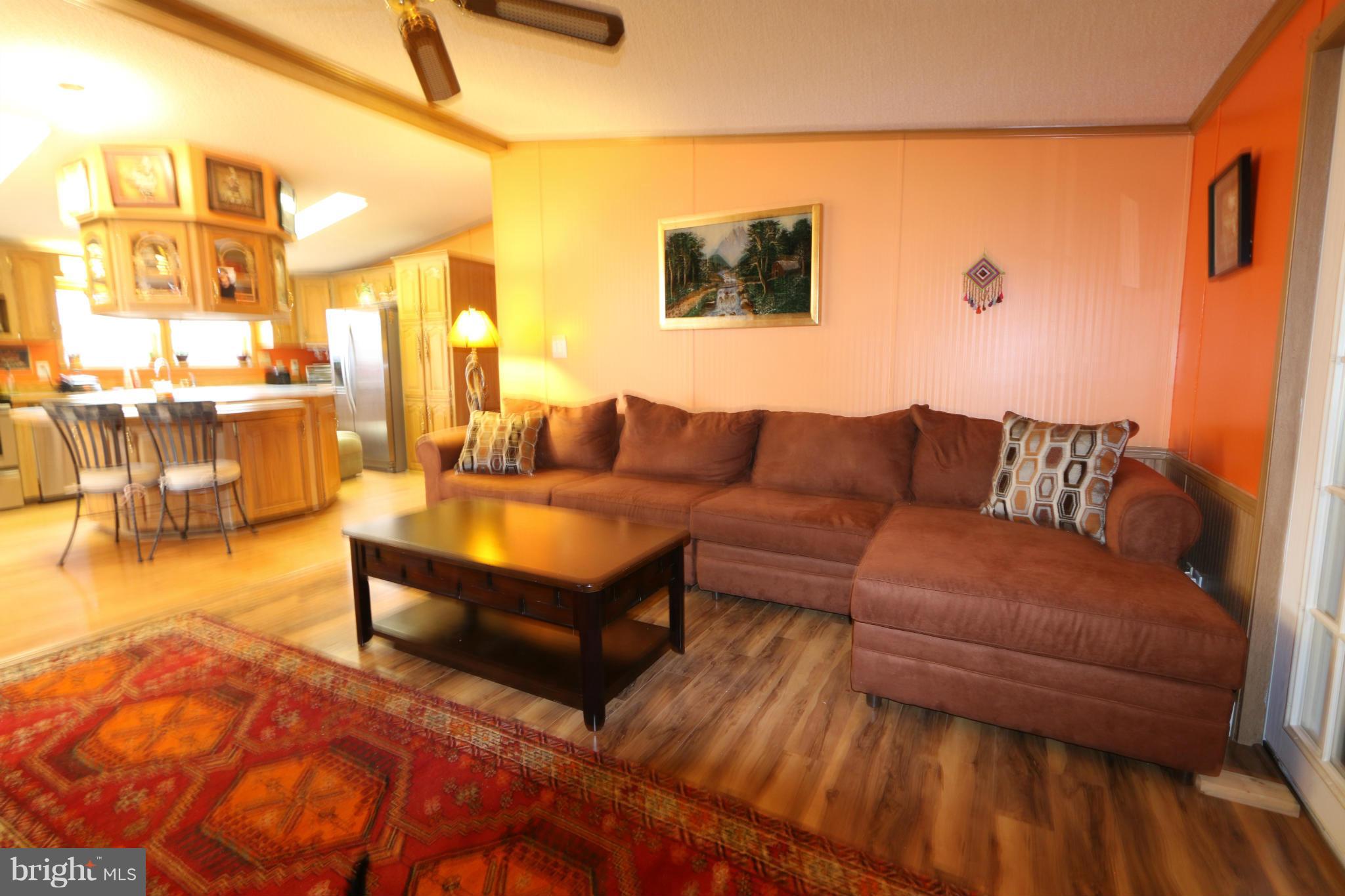 24709 Raven Rock Road Smithsburg, MD 21783 - Photo 10 of 20 a living room with furniture and a large window