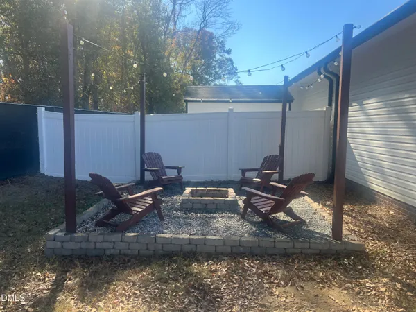 a house view with a backyard space