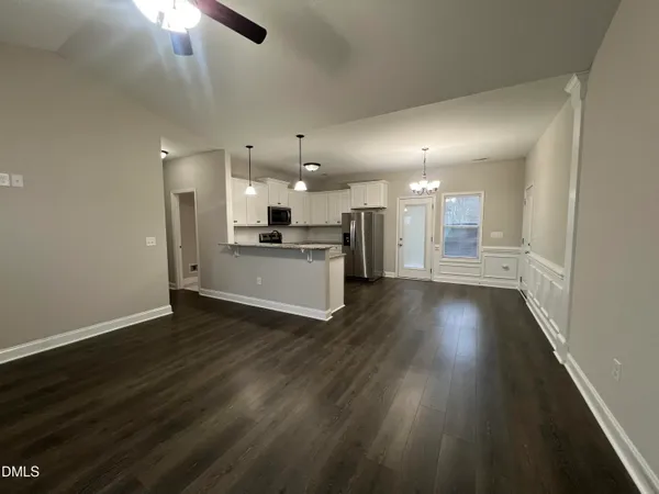 a view of a kitchen with a sink and a stove top oven