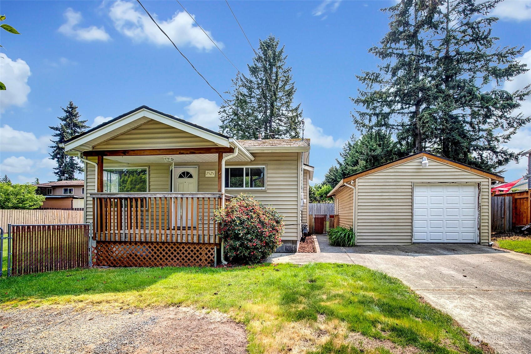 2525 Northeast 27th Street Renton, WA 98056 - Photo 1 of 30 a front view of a house with a garden