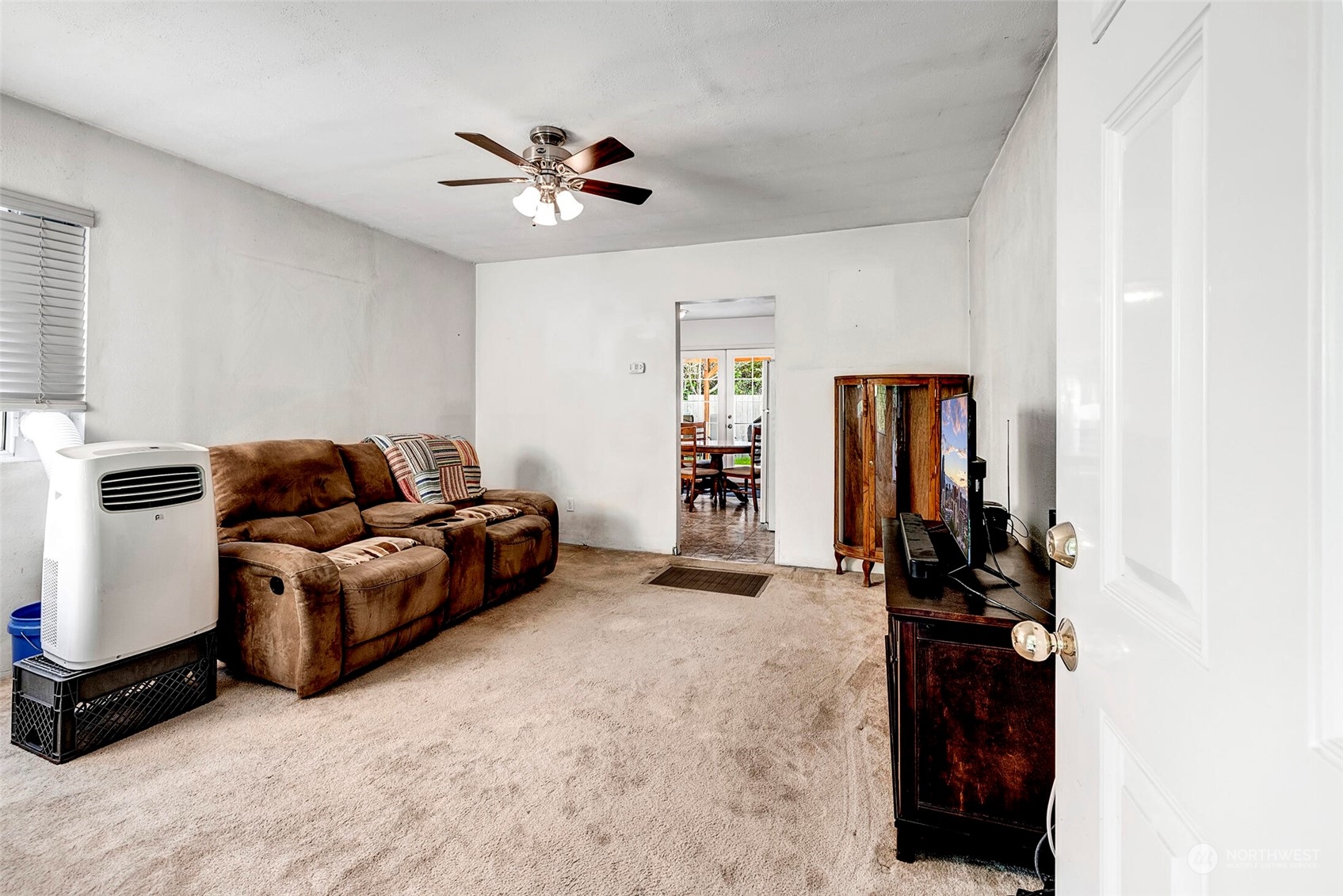 2525 Northeast 27th Street Renton, WA 98056 - Photo 3 of 30 a living room with furniture and a ceiling fan