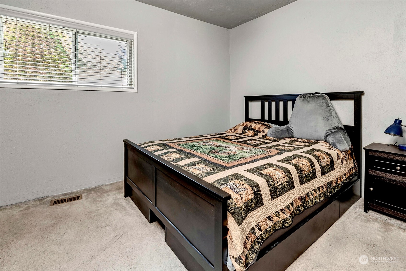 2525 Northeast 27th Street Renton, WA 98056 - Photo 10 of 30 a bedroom with a bed and window