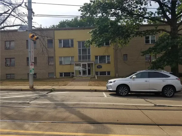 a car parked in front of a house