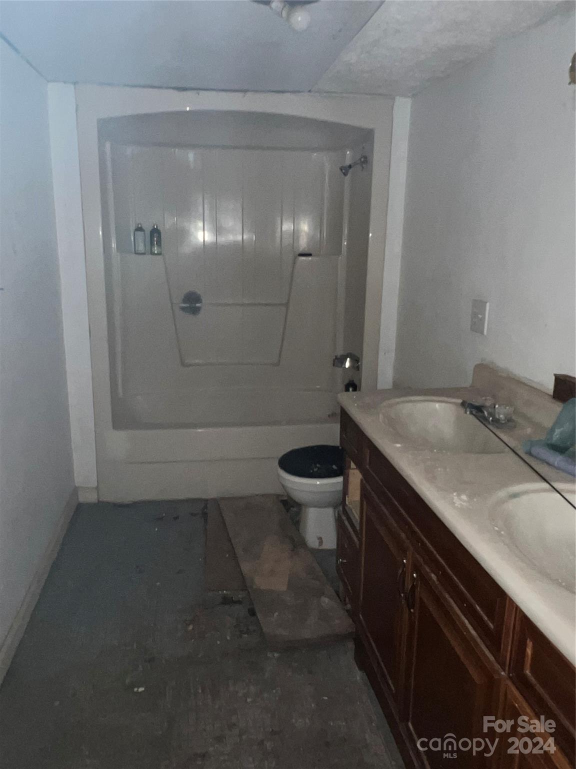 789 Groves Road Union Mills, NC 28167 - Photo 14 of 30 a bathroom with a granite countertop sink a toilet and shower