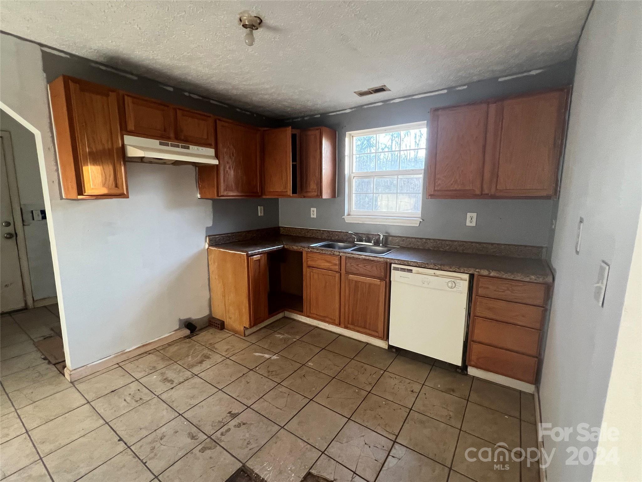 789 Groves Road Union Mills, NC 28167 - Photo 23 of 30 a kitchen with a sink a stove and cabinets