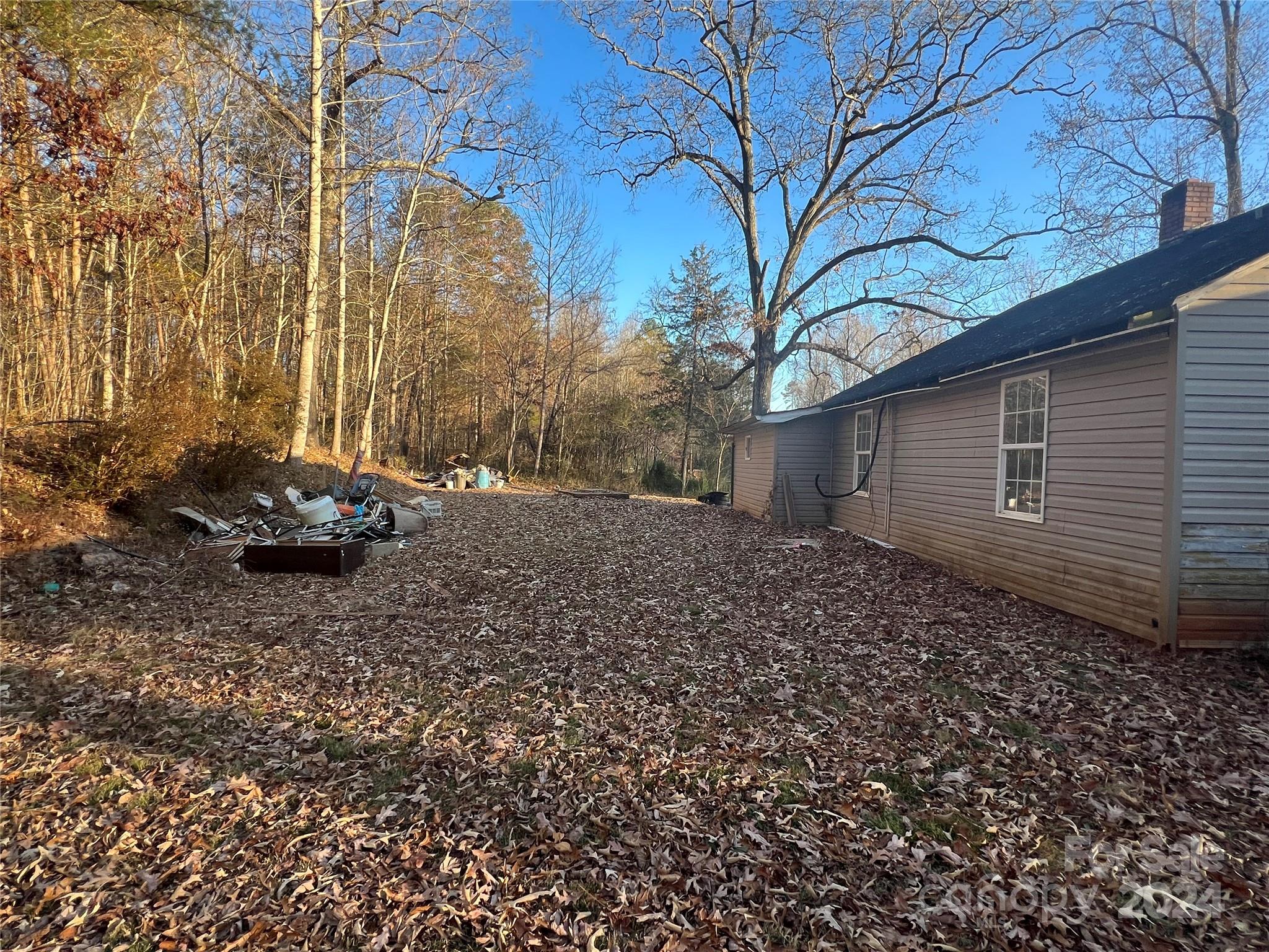 789 Groves Road Union Mills, NC 28167 - Photo 26 of 30 a backyard of a house with a large tree