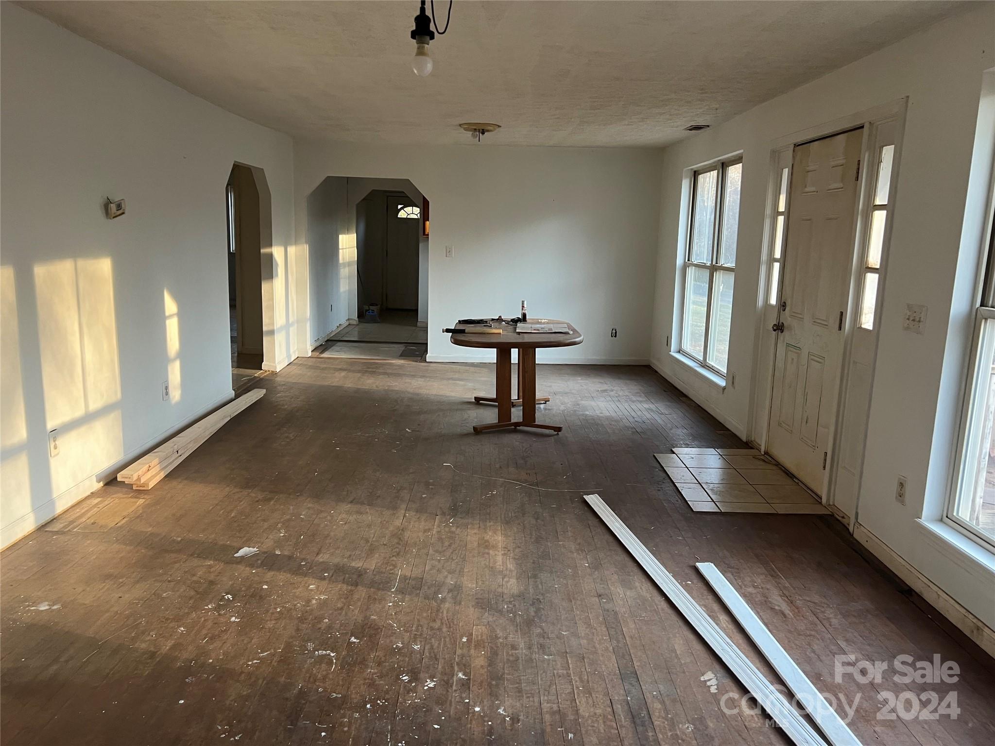 789 Groves Road Union Mills, NC 28167 - Photo 6 of 30 a view of a hallway with wooden floor and staircase