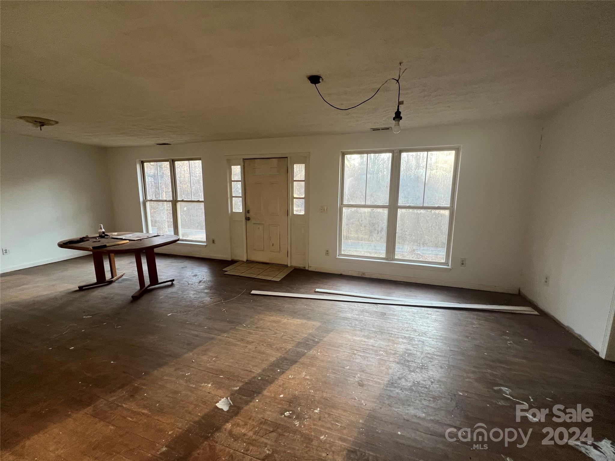 789 Groves Road Union Mills, NC 28167 - Photo 8 of 30 an empty room with windows and ceiling fan