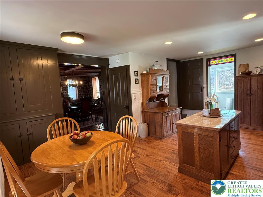 940 Jacktown Road Bangor, PA 18013 - Photo 8 of 33 Hearty wood flooring and cabinetry imbue this kitchen with rustic charm.