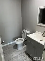 a bathroom with a toilet and a sink