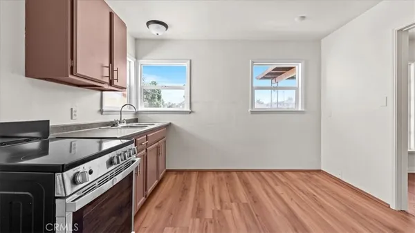a kitchen that has a sink and a stove