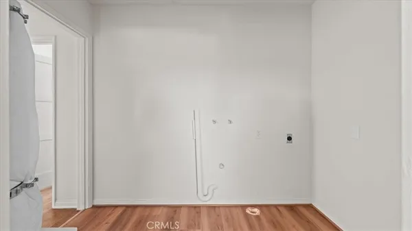 a view of a room with wooden floor and closet
