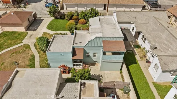 an aerial view of a house with a garden