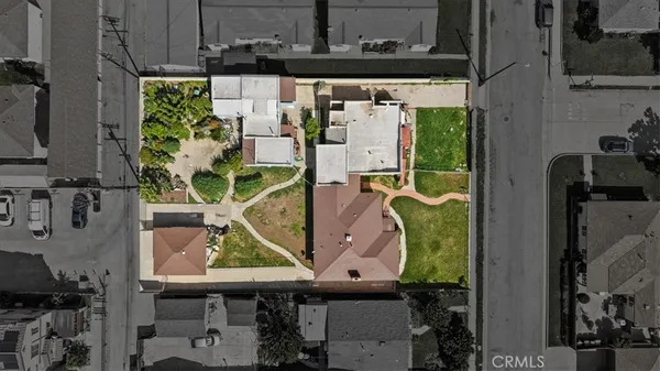 an aerial view of a house with a swimming pool